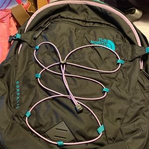 North face backpack black with purple string and green back